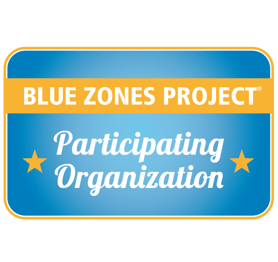 A blue and yellow sign with the words " participating organization."